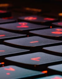 An image of a red glowing keyboard, typically seen on gaming laptops.